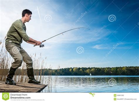 Fisherman Catching Fish Angling At The Lake Stock Photo Image Of