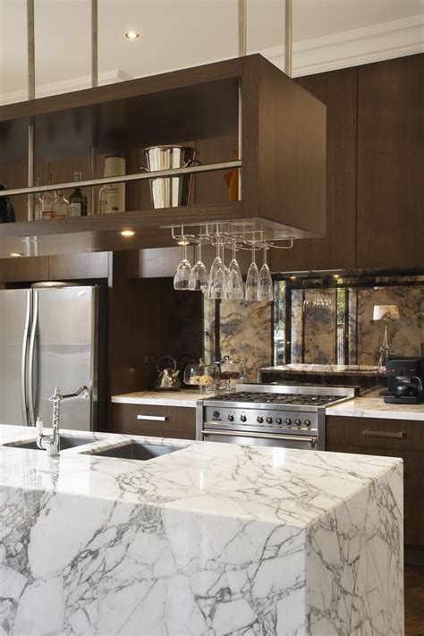 The elk lighting chadwick 665 kitchen island light is richly adorned with angled accents and a fresh, sleek finish. Marble Island Bench With Overhead Glass Rack. Ravida- Property With Distinction | Modern kitchen ...