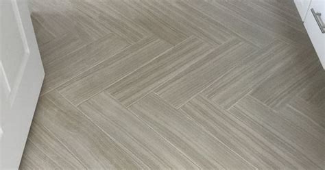 Santino Bianco 6x24 Tiles In Herringbone Pattern On Floor Of Bathroom