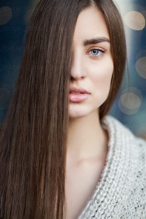 Young Beautiful Woman With Blue Eyes And Long Brown Hair