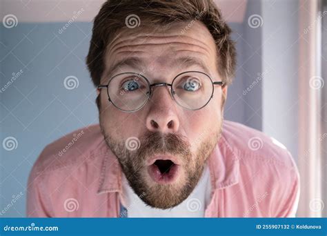Close Up Of An Amazed Man In Glasses With A Funny Expression On His