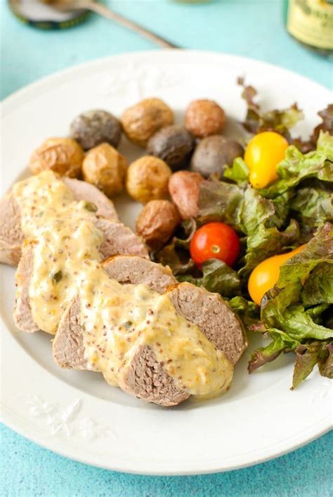 Combine pork and marinade into large, heavy resealable plastic bag and press out any air. Slices of Pork Tenderloin with Mustard Caper Cream Sauce, fresh salad and roasted potatoes on a ...