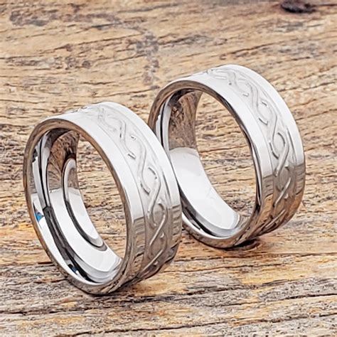 Here's a dramatic infinity ring symbolizing commitment. Jupiter Mens Carved Infinity Rings | Tungsten wedding ...