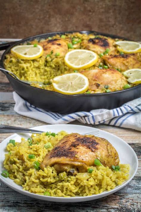 The chopped cashews on top add crunch and even more healthy nutrition. One Pot Lemon-Garlic Chicken with Yellow Rice - Dishing Delish