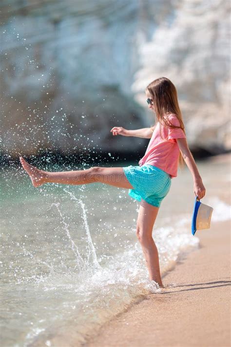 Adorable Active Little Girl At Beach During Summer Vacation Stock Image