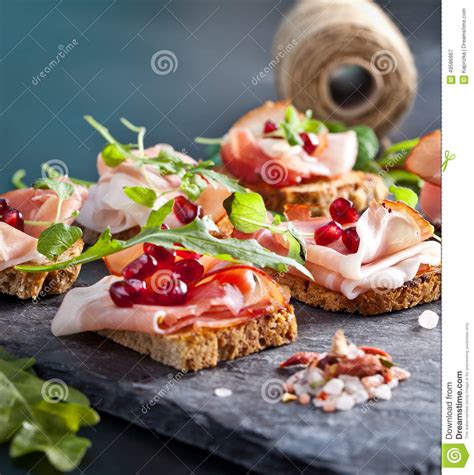 Sliced Prosciutto With Herbs And Pomegranate Seeds Stock Image Image