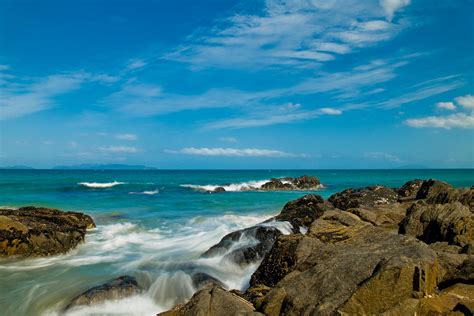 Sea Landscape With Beach Coast Rocks And Blue Sky Photograph By U