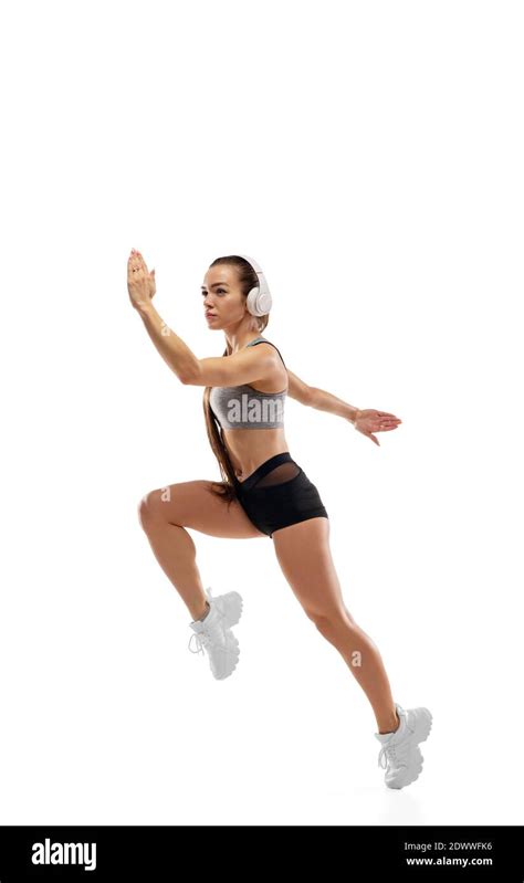 Jump Up Caucasian Professional Female Athlete Runner Training Isolated On White Studio