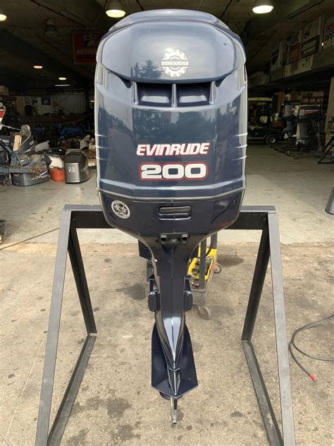 Forget what you thought about two stroke. 2002 Evinrude 200 HP V6 DFI 2 Stroke 20″ (L) Outboard ...