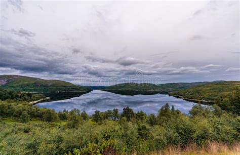 Norway Landscape With Lake And Reflection Cloudy Blue Sky Stock Image