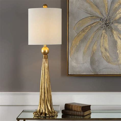 This modern lamp adds character to any space with its bold, artistic design. Uttermost Paravani Antique Metallic Gold Buffet Table Lamp - #32N99 | Lamps Plus