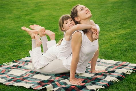 Mother With Daughter Doing Yoga Exercise Yogaschule Bergkamen