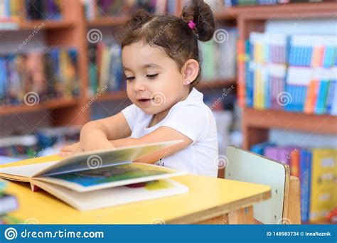 Happy Child Little Girl Reading A Book Stock Photo Image Of Learning