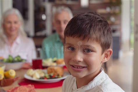 Boy Sitting At Dining Table At Home Stock Image Image Of Drink