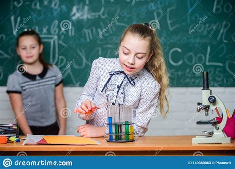 Girls Working Chemical Experiment. Natural Science. Educational Experiment. School Classes ...