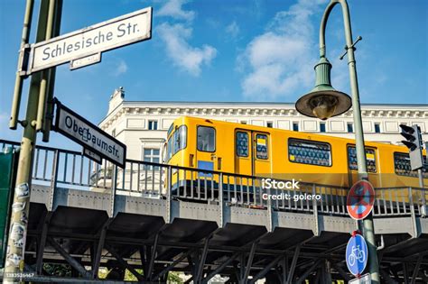 Yellow Metro Train On Elevated Railway Track In Berlin Kreuzberg Stock