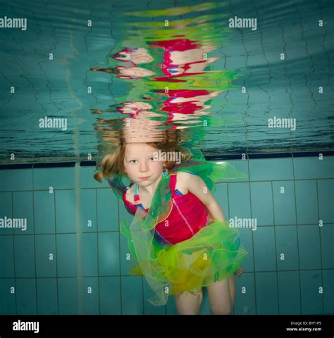 Little Girl Swimming Underwater In Colorful Costume Stock Photo Alamy