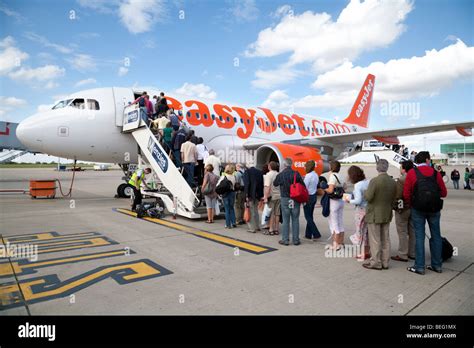 Passengers Boarding An Easyjet Plane At Stansted Airport Uk Stock