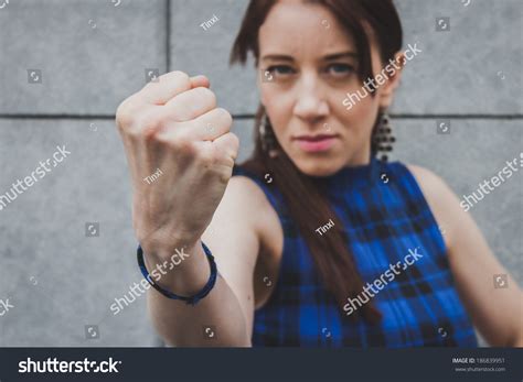 Menacing Pretty Girl Showing Her Fist Stock Photo Shutterstock