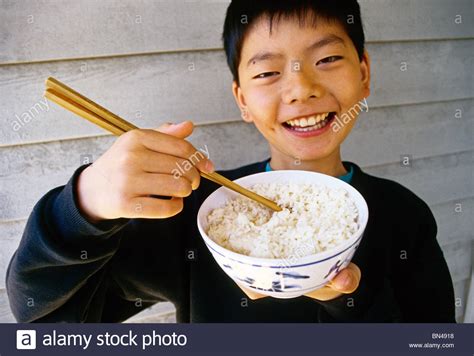 How to make a rice with chopsticks banner in minecraft! Chinese boy eating with chopsticks from rice bowl Stock Photo - Alamy