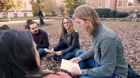 Happy Group Of College Students Studying Outside During The Autumn