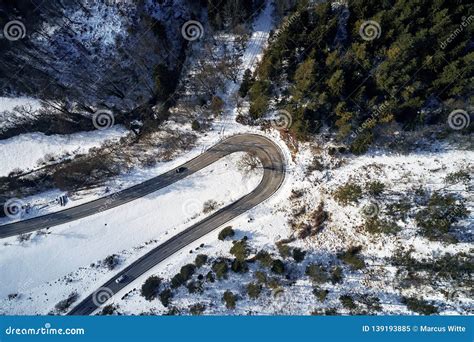 Curved Road In Winter Mountain Landscape Aerial View Of Forest And
