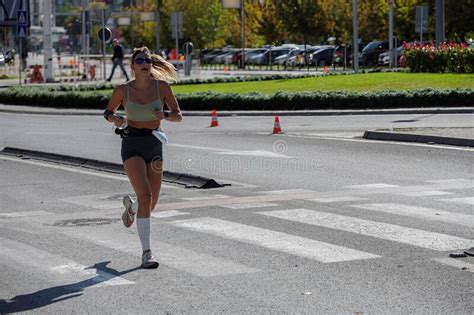 Female Marathon Runner On A City Street Editorial Image Image Of
