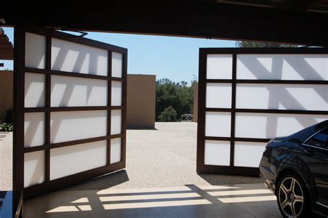 We had work done on magnetic doors which are very hard to find. full view glass - custom garage bi-parting door ...