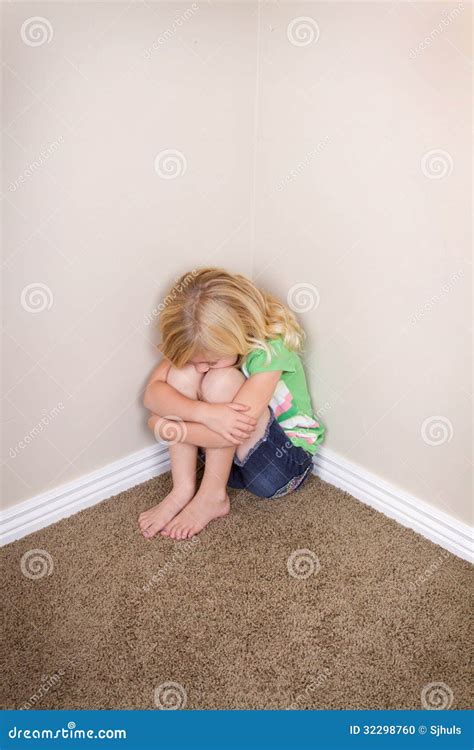 Worried Sad Girl Child In Sitting In Corner Stock Photo Cartoondealer