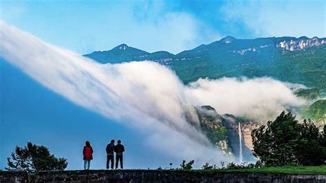 Cloud Waterfall Cascades Over Sw Chinas Mt Jinfo Cgtn