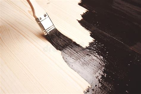 Because varnishing may cause the surface of your painting to be more reflective, you may want to photograph your work before you varnish. Varnishing Of Surface Of Beech Table Top Stock Photo ...