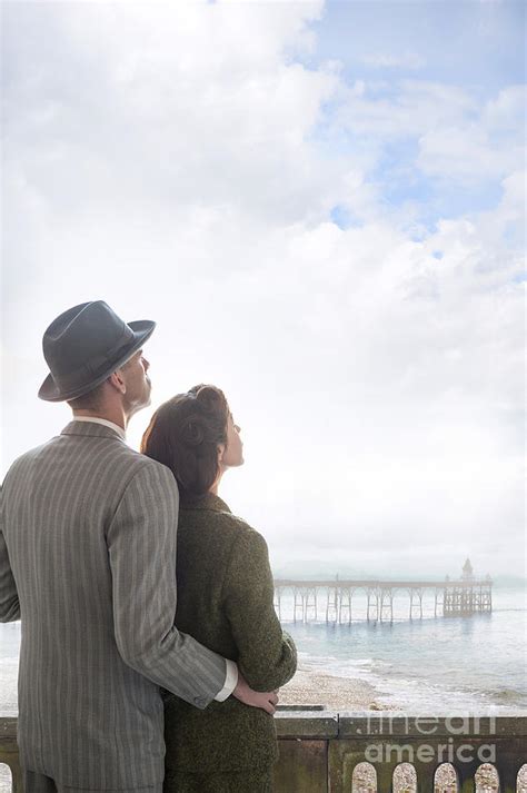 1940s Wartime Couple At The Coast Looking Skyward Photograph By Lee
