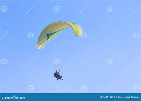 The Pilot Flies On A Motorized Parachute At A Hot Air Balloon Fethe