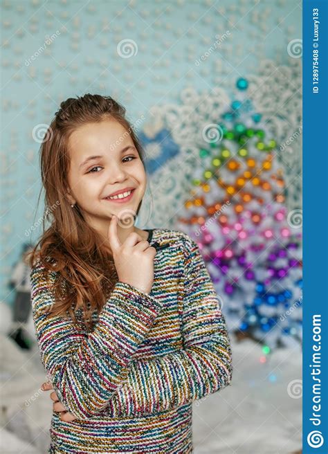Happy Child Smiles At Home The Concept Of Merry Christmas New Stock