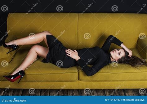 Beautiful Model In Black Dress Laying On Sofa Stock Image Image Of