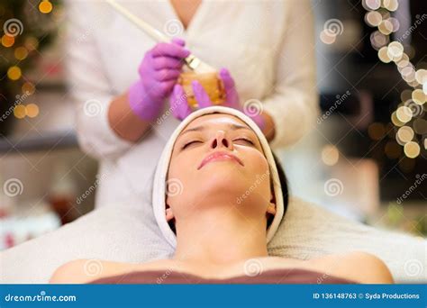 Beautician Applying Facial Mask To Woman At Spa Stock Image Image Of