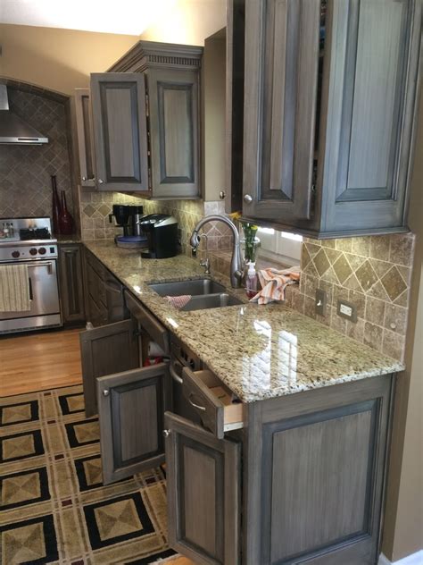 We saved her thousands of dollars by refinishing her existing cabinets. Kitchen Cabinets : Blonde Pickled to Medium Gray ...