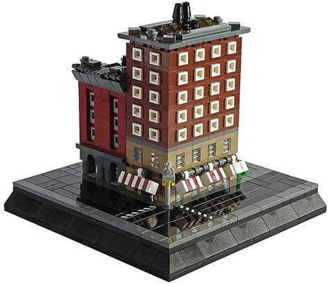 A Lego Model Of A Building With People Walking Around It On The Street