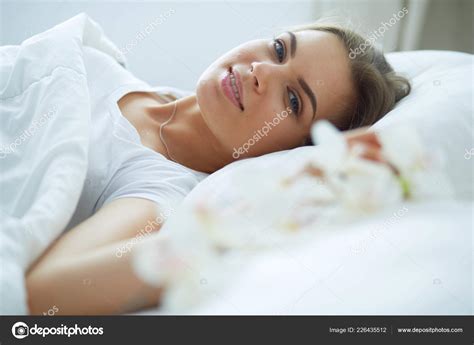 Beautiful Young Blonde Woman Sleeping In Bed Stock Photo By ©lenets
