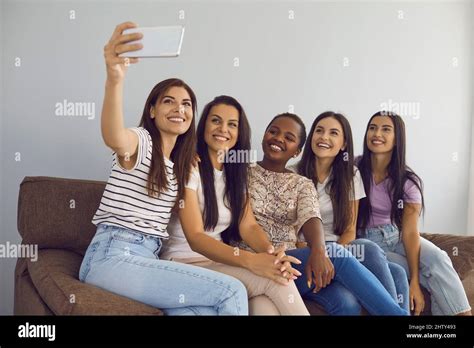 Multiracial Female Best Friends Take Selfies Together And Capture Moment With Mobile Phone
