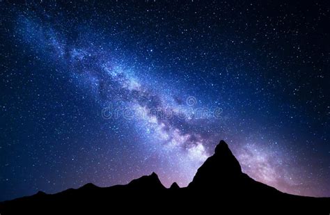 Bright Milky Way Over Snow Covered Mountains And Sea At Night Stock