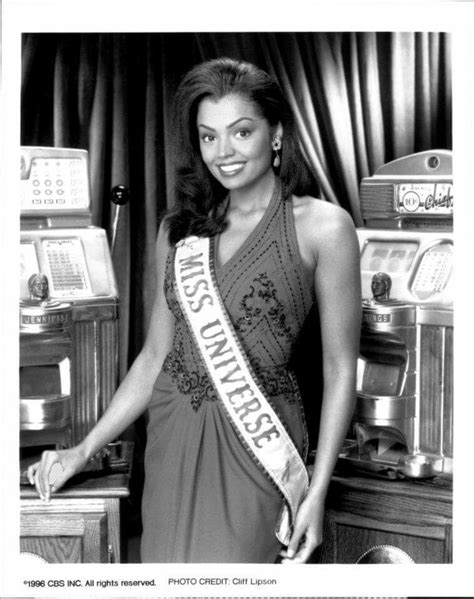 A Black And White Photo Of A Woman Wearing A Miss South Africa Sash In Front Of Coffee Machines