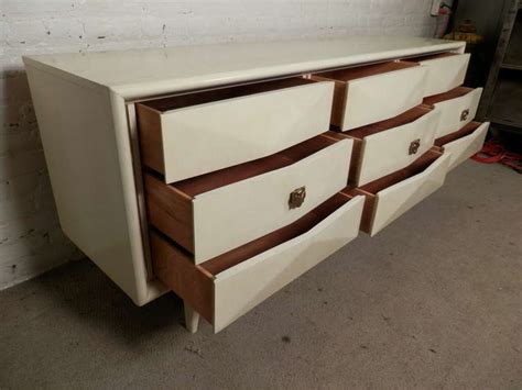 Made with select hardwood veneers, hardwood solids and furniture grade resin. Diamond Front Mid-Century Dresser By United Furniture ...