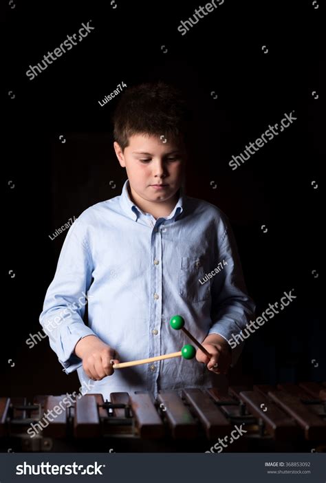 Boy Playing On Xylophone Black Background Stock Photo 368853092