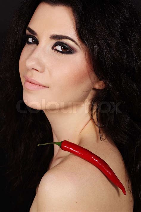sexy brunette girl with red cayenne pepper stock image colourbox