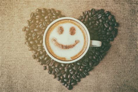 Coffee With Foam Milk Art Smile Pattern In Heart Shape Stock Photo
