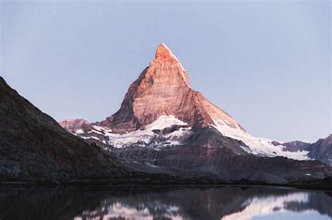 Bright Summer Sunrise Above Beautiful Mountain Lake And Matterhorn In