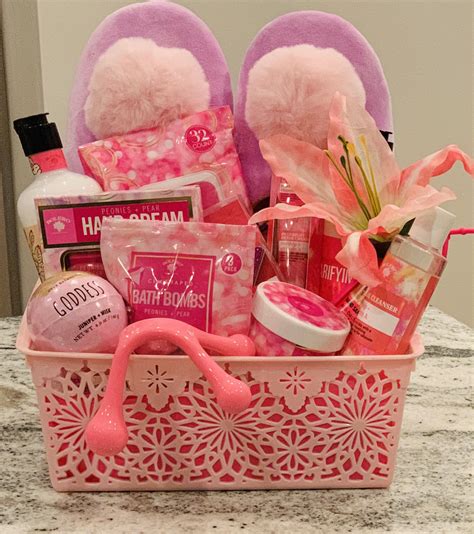 A Pink Basket Filled With Personal Care Items On Top Of A Marble