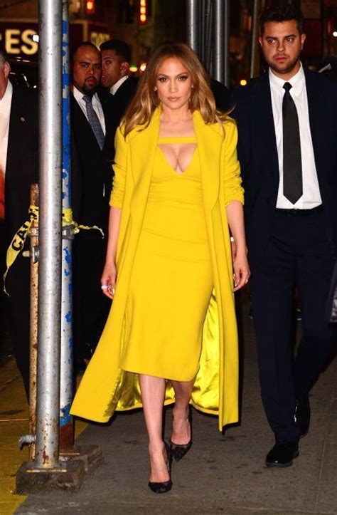 Jennifer Lopez Out In Midtown Manhattan Wearing A Plunge Neck Yellow Body Con Dress And A
