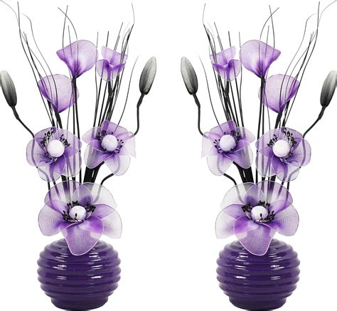 Matching Pair Of Purple Vases With Purple And White Artificial Flowers